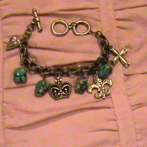 Handcrafted Charm bracelet turquoise color beads with silver charms